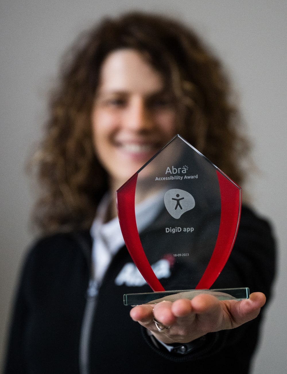The Abra Accessibility Award is made of glass with a red border