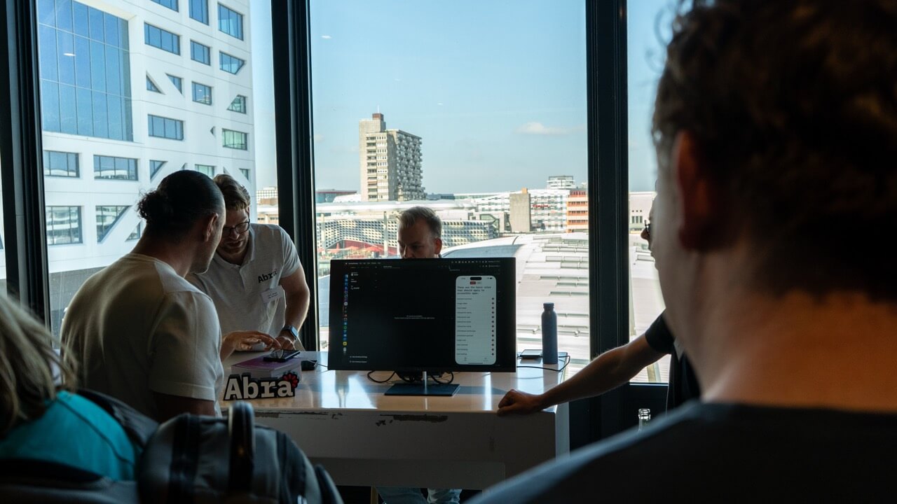 Attendees standing in line for a quickscan of their app using Abra tooling