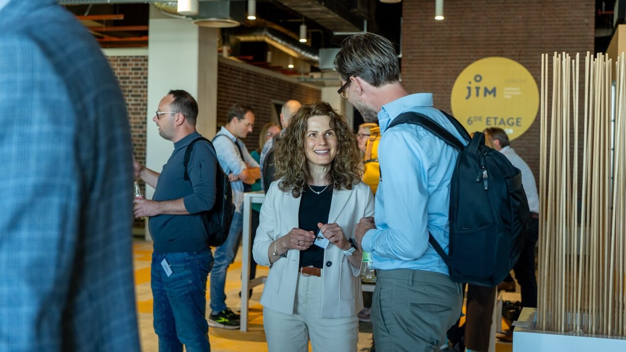 Attendees interacting with each other during networking event
