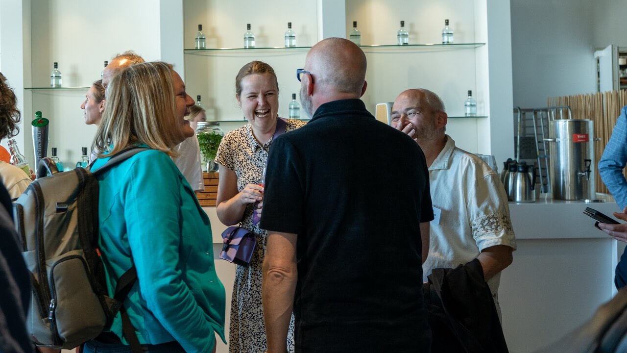 Participants laughing during network event