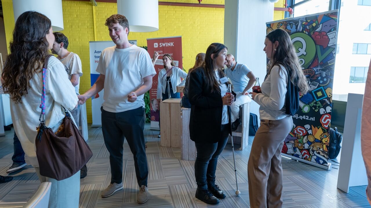 Attendees talking at partner stands